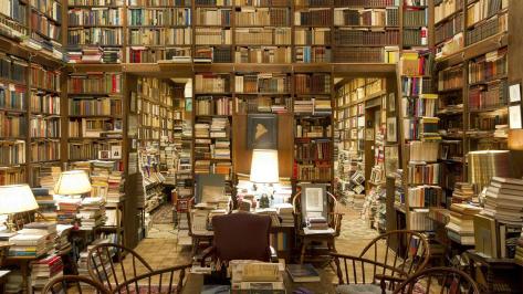 mansion library Piles-of-books-in-a-private-college-library_www.LuxuryWallpapers.net_